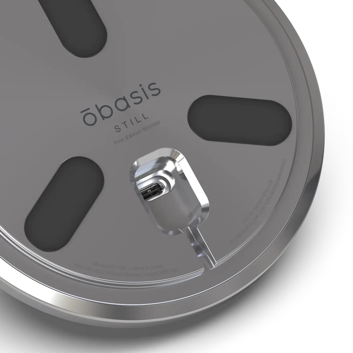 Close-up of the STILL stainless steel base showing the engraved First Edition serial number position.